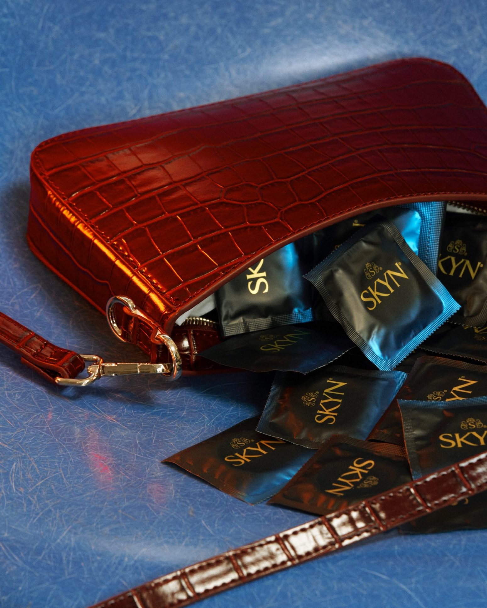 Purse filled with SKYN condoms