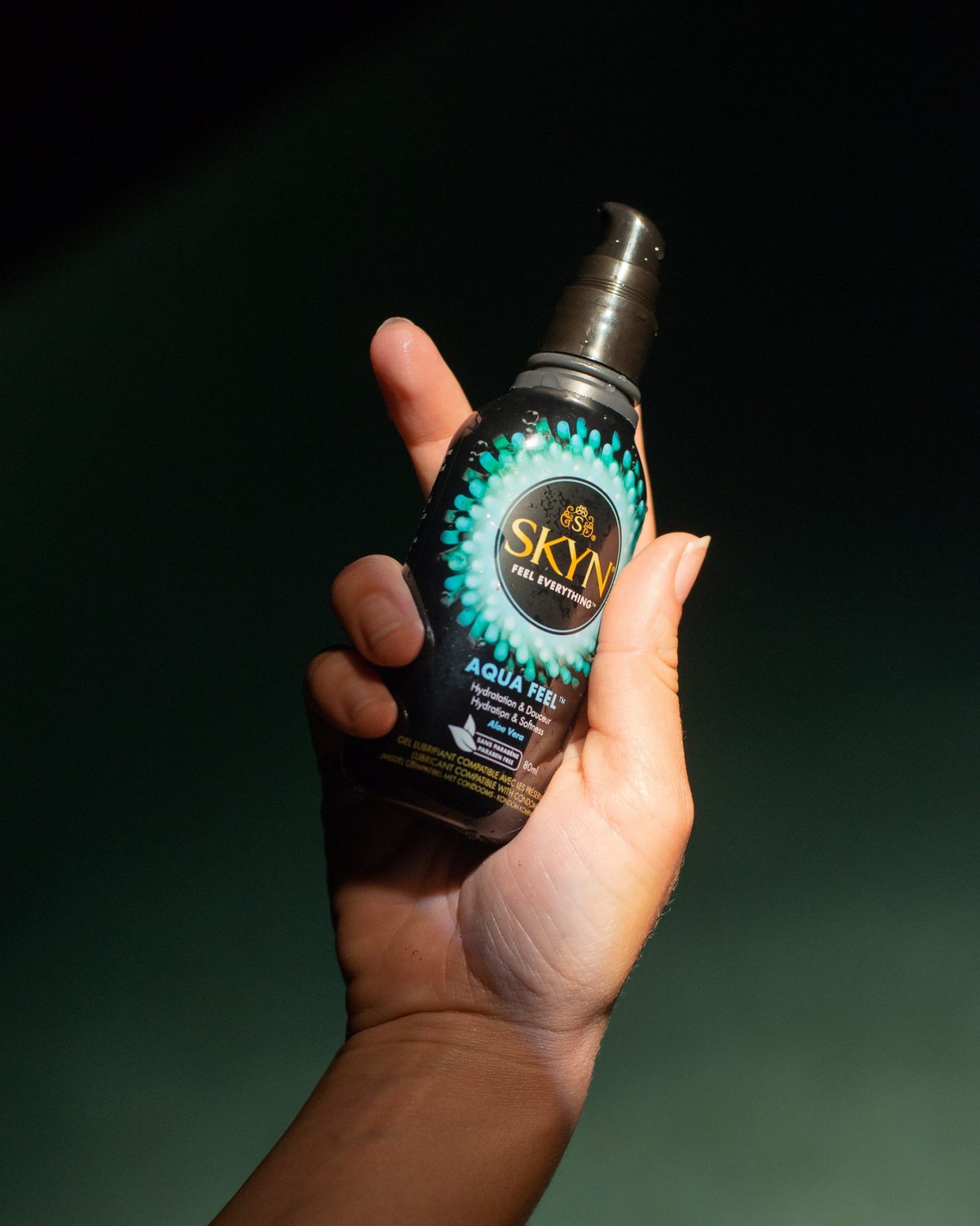 Hand holding SKYN Aqua Feel Lubricant